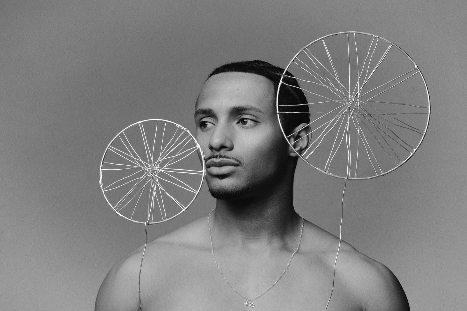 Constructed. athlete portrait with sculptural wheels by Katrina Dobbermane